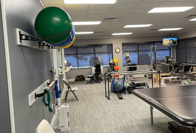 A client performing Physical Therapy exercises at West Michigan Rehab and Pain Center